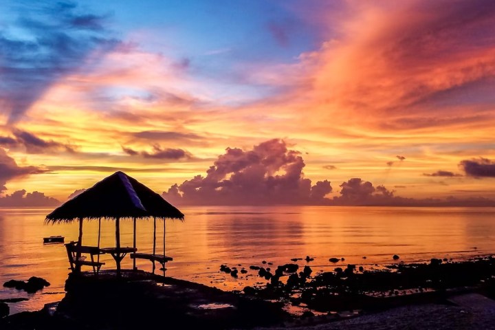 a sunset over a body of water